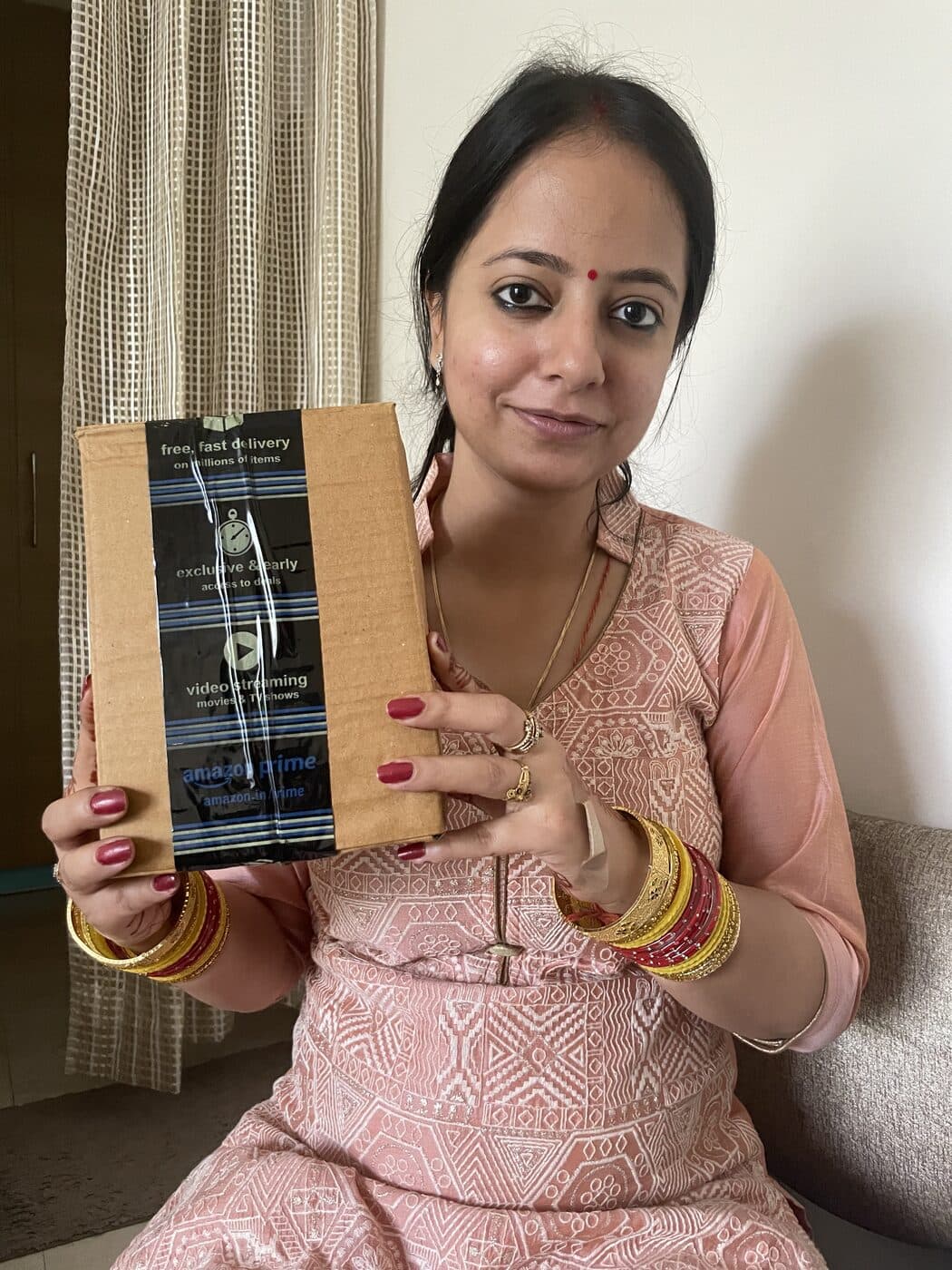 Holding the parcel for our first Amazon order